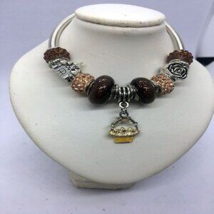 Silver Twist Bracelet with Brown and Peach Crystal Beads and Basket Charm